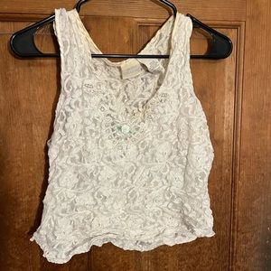 White knit slightly cropped tank top with rose